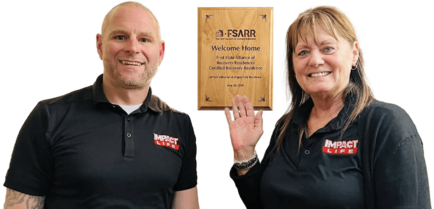 People standing with FSARR plaque